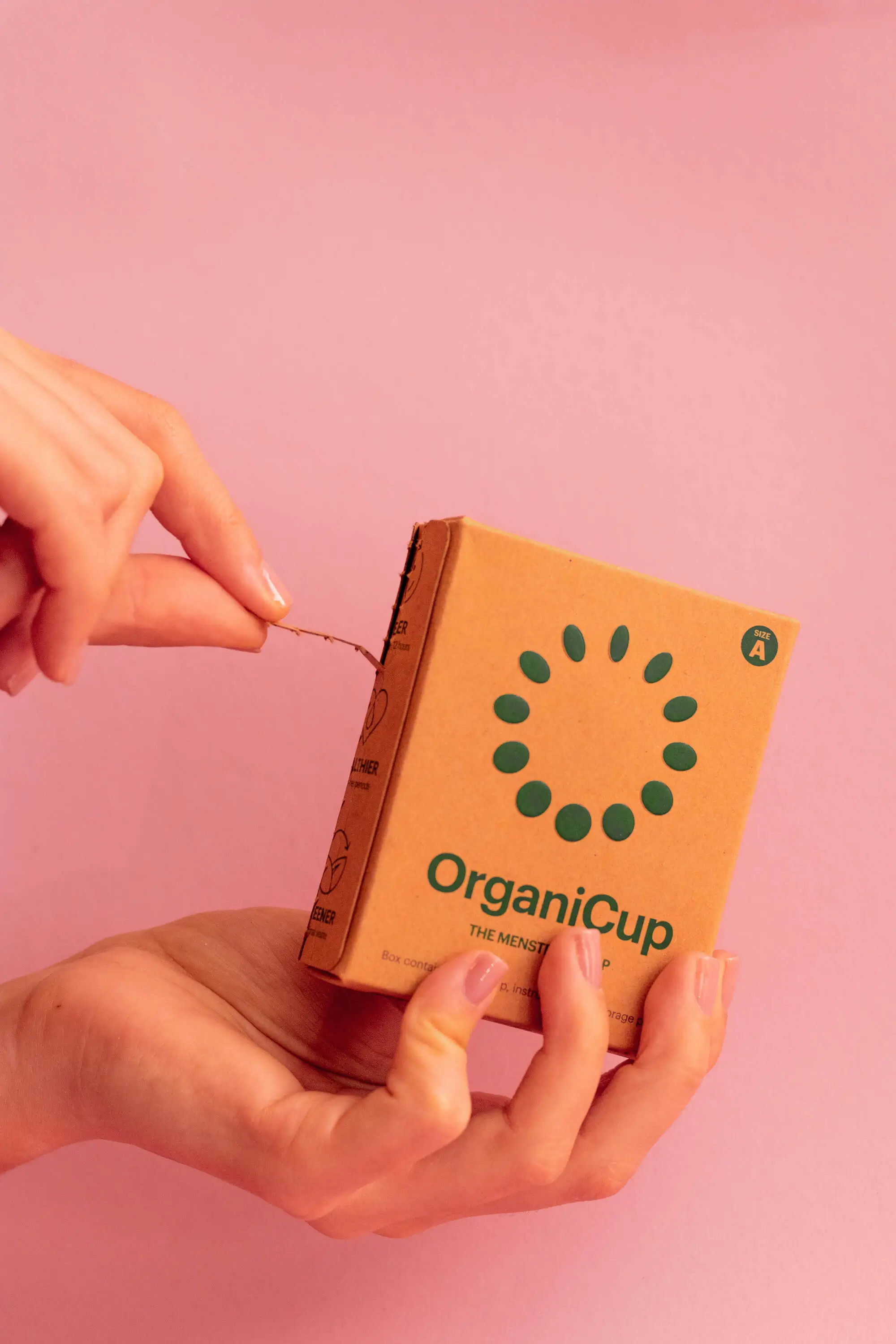 Small cardboard packaging being torn open